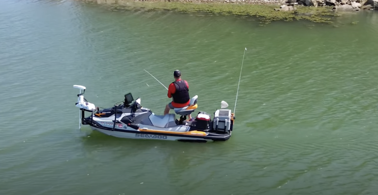 Aerial view of man fishing from a Sea Doo watercraft. The watercraft has "The Revolution" product by One Off Outdoors installed.